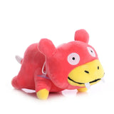 Peluche pokémon ramoloss slowpoke représentant koffing rouge et jaune avec yeux blancs et sourire adorable peluche capture