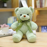 Peluche teddy bear couleur verte menthe douce en peluche avec yeux boutons noirs nez cousu brun et ruban satin vert olive