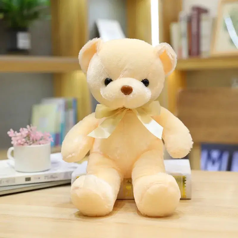 Peluche teddy bear couleur beige crème en peluche douce avec yeux boutons noirs et nœud satin assorti