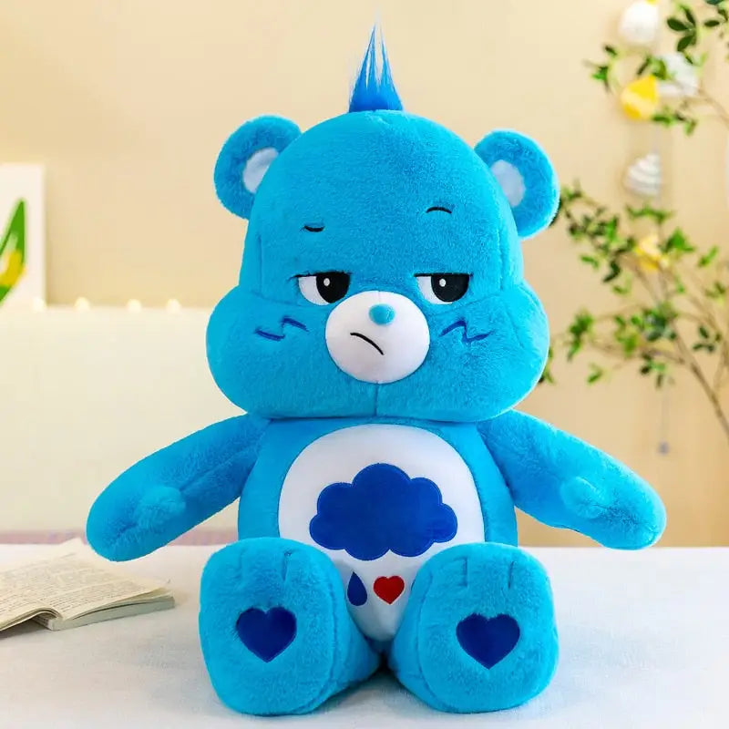 Peluche bisounours care bear bleue avec patch ventre blanc nuage bleu et coeur rouge peau couture serrée