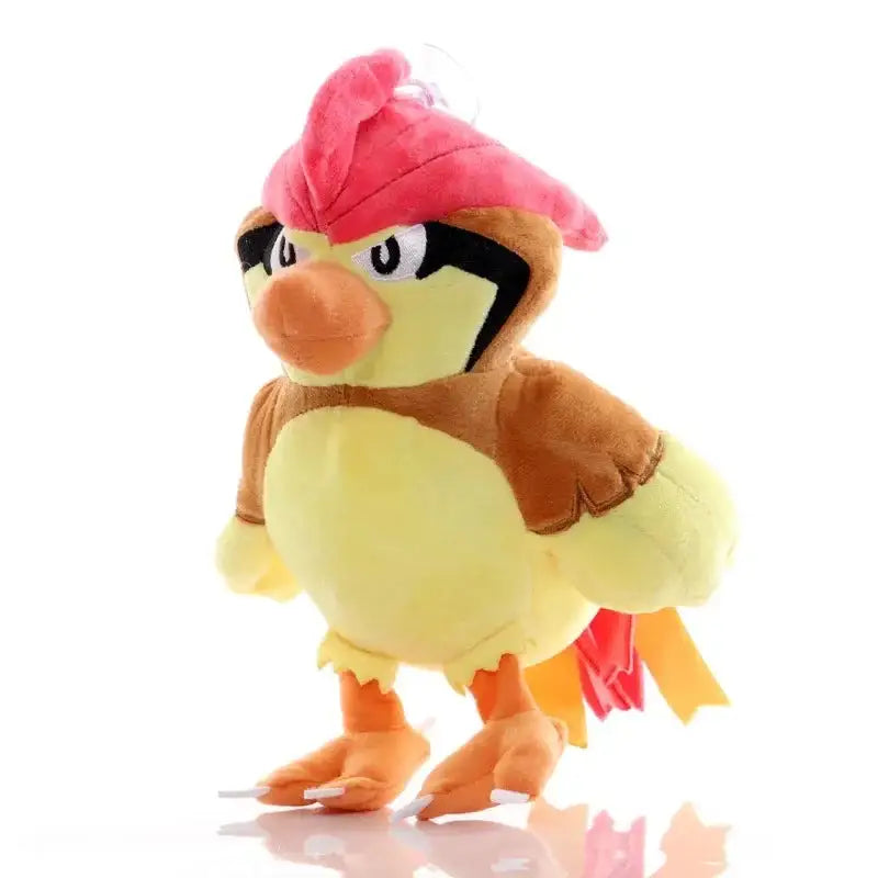 Peluche pokémon personnages kawaii de charizard avec casquette rose vif, corps jaune, ailes brunes et pieds orange