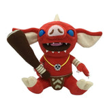 Peluche zelda botw bokoblin korok rouge aux yeux bleus avec crocs blancs et collier jaune à pendentif crâne