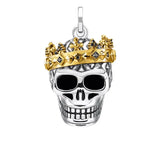 Pendentif tête de mort couronnée en argent avec couronne en or sertie de diamants noirs finition soignée