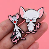 Minus and Cortex Cartoon Pin
