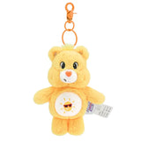 Porte-clé peluche bisounours jaune avec ventre blanc décoré d’un soleil souriant portant des lunettes de soleil
