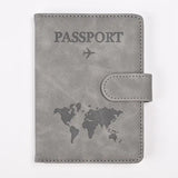 Protège-passeport rfid gris en cuir synthétique avec carte du monde embossée et avion pour voyage sécurisé