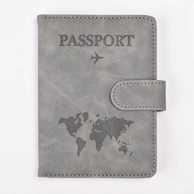 Protège-passeport rfid gris en cuir synthétique avec carte du monde embossée et avion pour voyage sécurisé