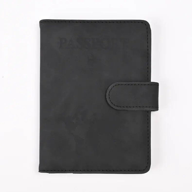 Protège-passeport rfid antimagnétique en cuir synthétique noir avec design minimaliste et fermeture à sangle assortie