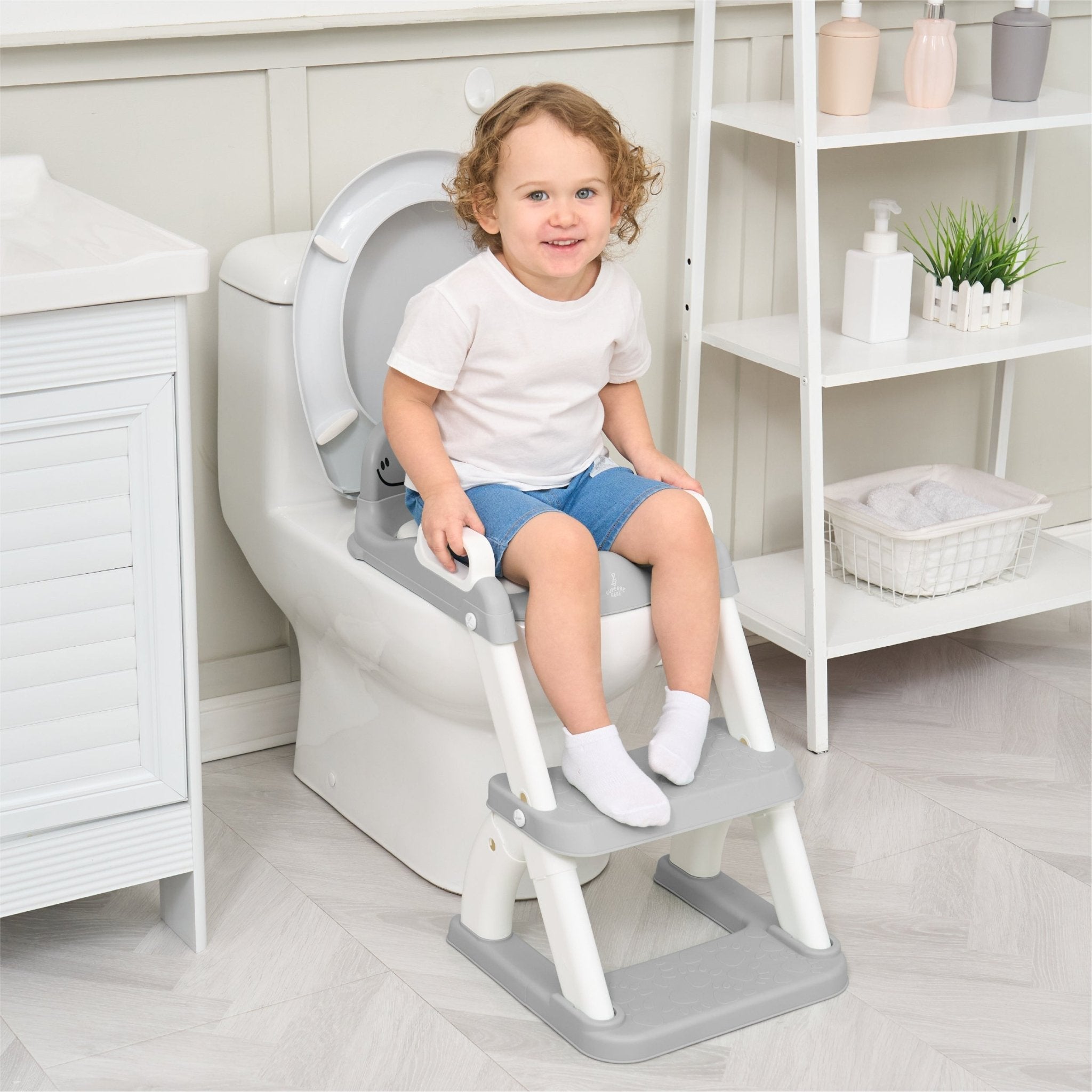 Réducteur de toilette DINO avec marche pliable