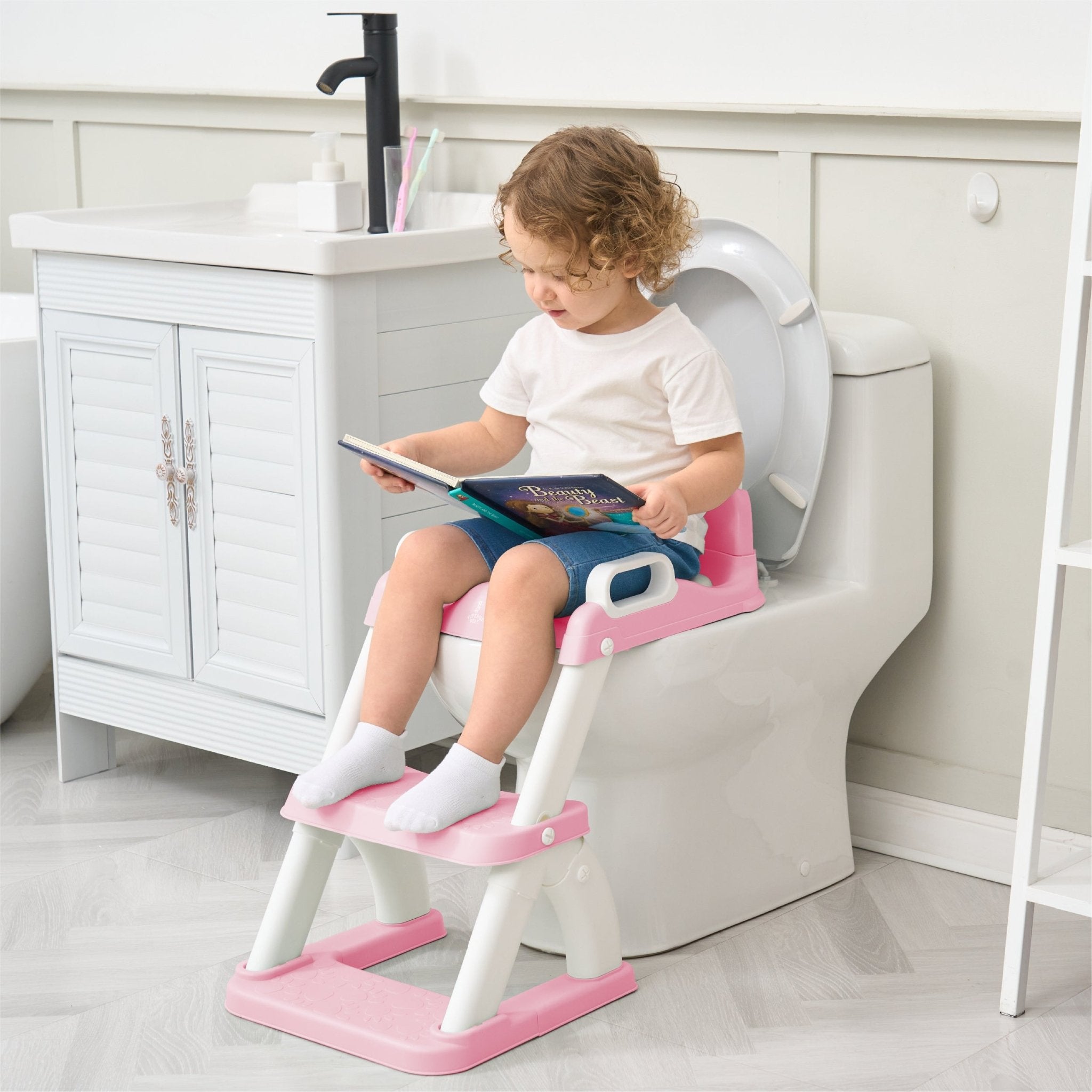 Réducteur de toilette DINO avec marche pliable