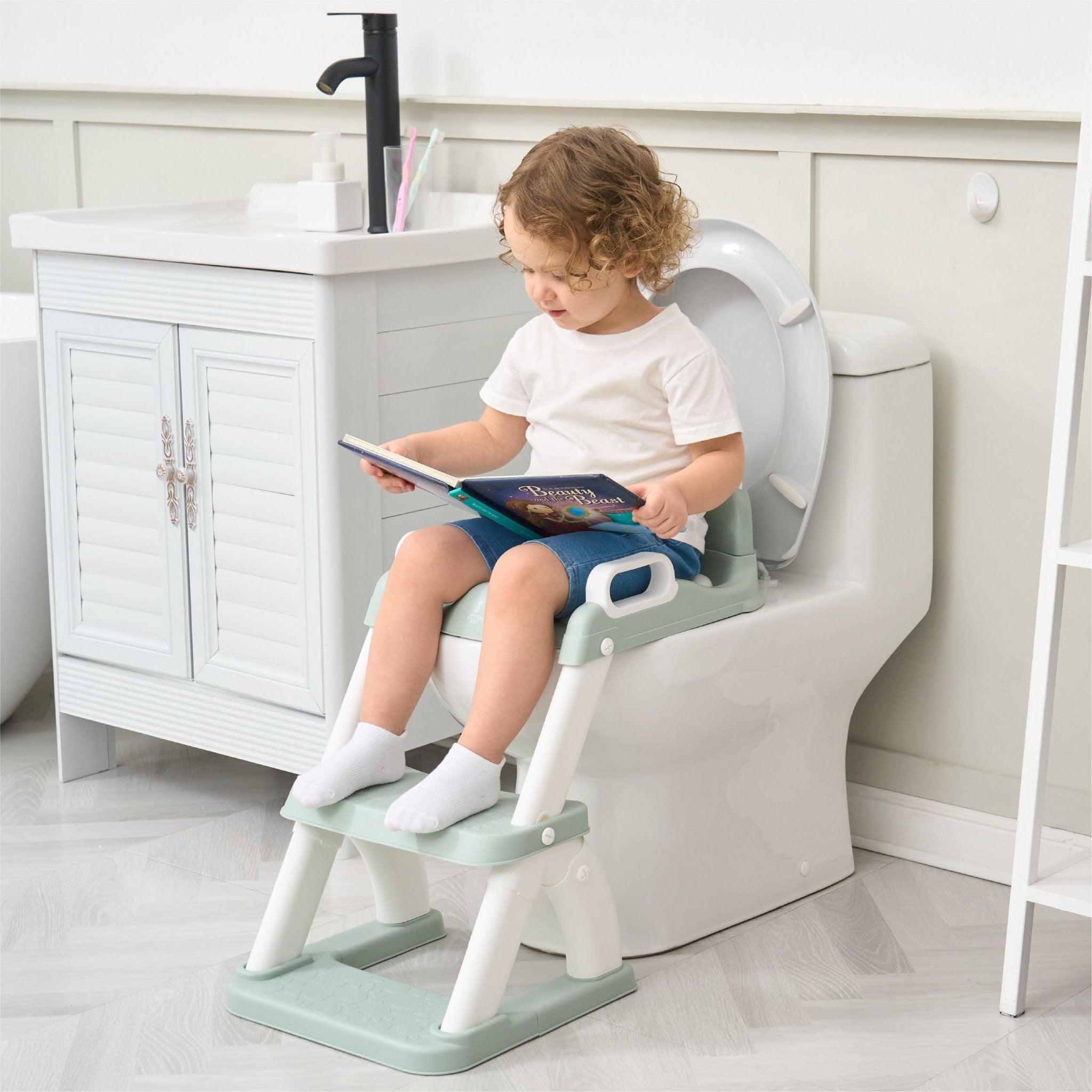 Réducteur de toilette DINO avec marche pliable