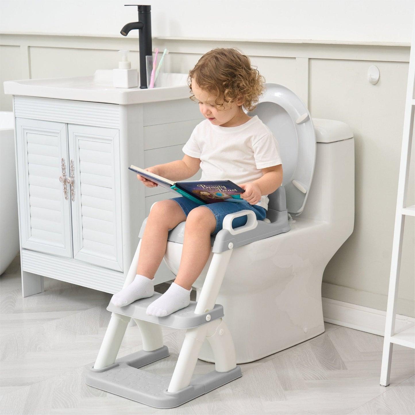 Réducteur de toilette DINO avec marche pliable