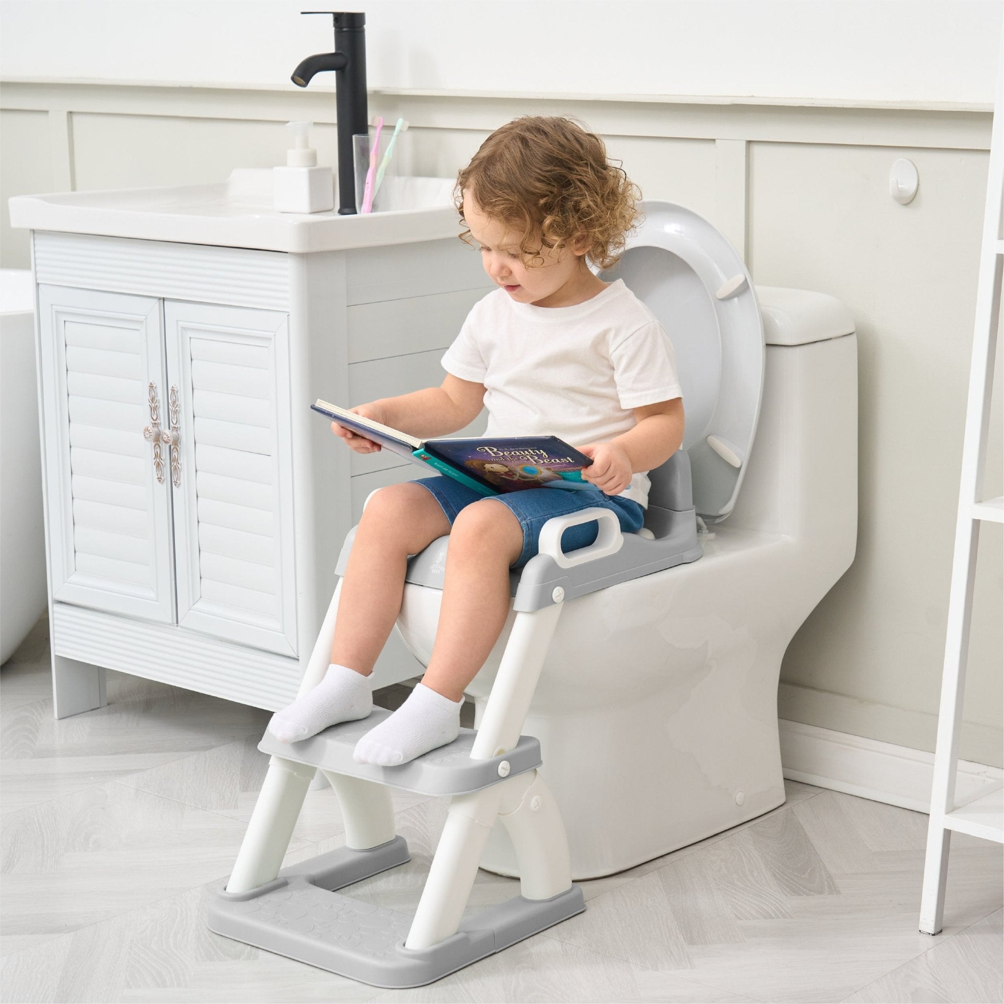 Réducteur de toilette DINO avec marche pliable