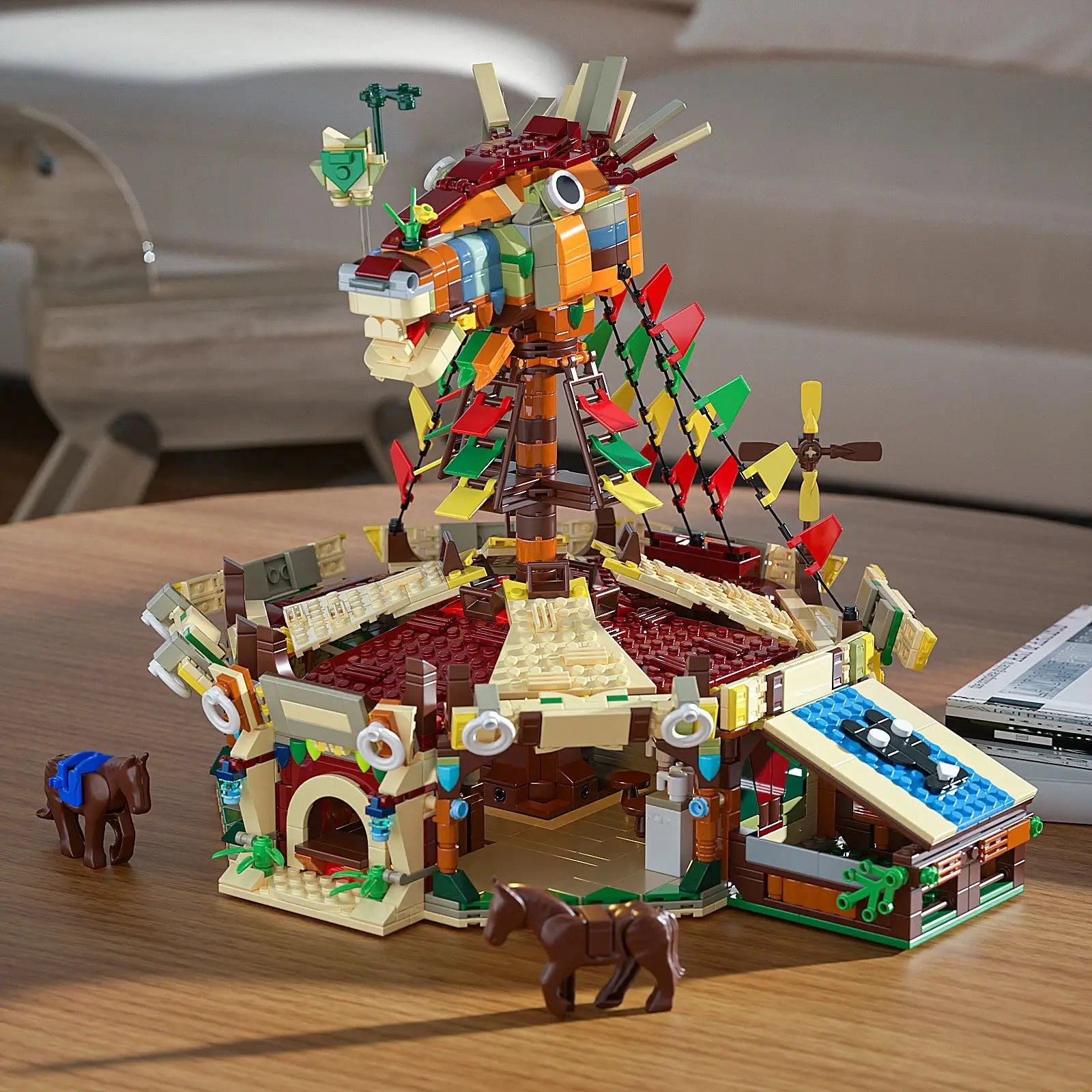 Ensemble lego zelda breath of the wild coloré avec une structure de dragon détaillée, drapeaux et chevaux
