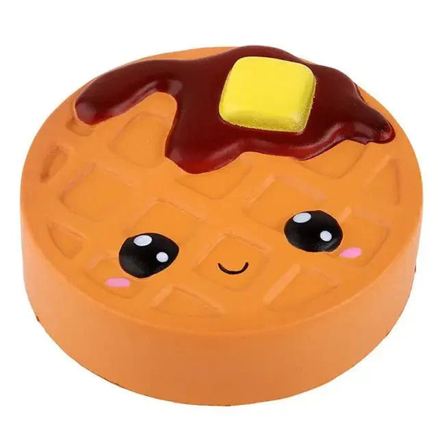 Squishy biscuit chocolat orange en forme de gaufre avec visage souriant et beurre jaune pour relaxation immédiate