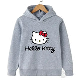 Sweat capuche hello kitty enfant gris avec nœud rouge et texte cursif noir sur le devant