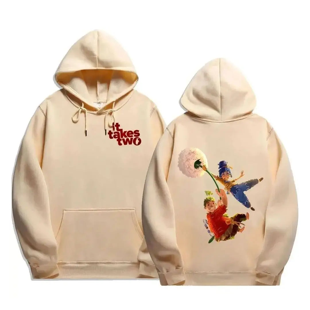 Sweatshirt à capuche crème avec logo iconique it takes two et poche kangourou featuring deux personnages animés volant avec un pissenlit