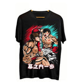 T-shirt anime ippo noir avec graphisme vibrant de hajime no ippo et baki hanma en combat intense