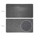 Dos du tapis souris xxl en feutre de laine gris avec motif circulaire de points blancs pour surface douce et confort optimal