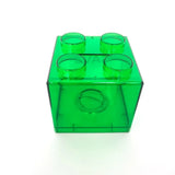 Tirelire lego unique en plastique vert transparent hommage aux célèbres briques lego avec quatre picots et trou central