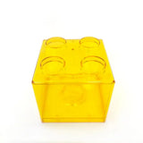 Tirelire lego unique en boîte de rangement plastique jaune transparent hommage aux célèbres briques lego