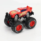 Voiture disney cars monster truck rouge avec pneus noirs et suspension argentée pour aventures hors-piste palpitantes