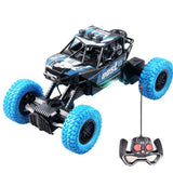 Voiture télécommandée tout terrain noire et bleue avec pneus turquoise lumineux à lumières clignotantes